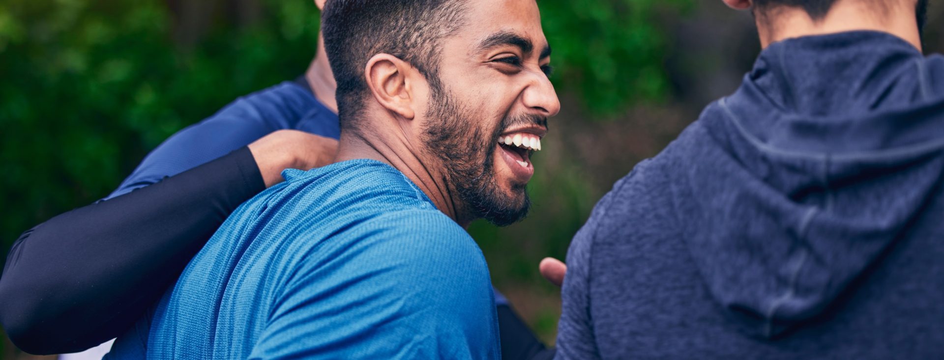 Happy, men and friends laughing for fitness, workout and running outdoor with a smile. Exercise, tr.