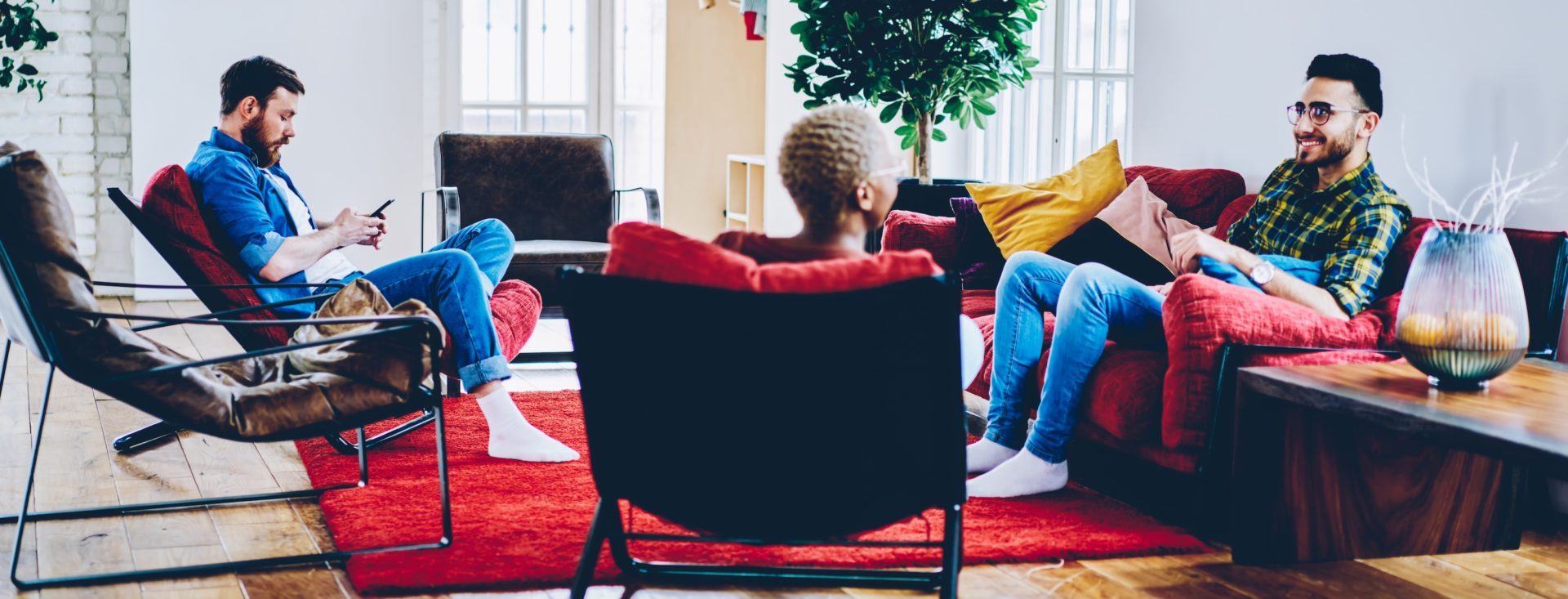 Young male and female guests discussing friendship relations during weekend meeting in loft apartment with comfortable red furniture, students talking about design project during leisure time SSUCv3H4sIAAAAAAAEAJ2RTY6EIBCF95PMHQxrTRT/5yqdWZRQUdIIHcCZdDrefRC0w3p21Peoot7j9fmRZWQCKxj5yl5H5Wsh5WadASe08rjMT25QcTQpQS6cNgJkCidwbFGwoodqk/LAexCJdeA2i/Z47EQMHM5+RoTvEXGjW6yzSwii7/ASIXnC7DYFdqE9/3dnPHxfbmBGxZ5h4cSIQYkQjdziVXL/dWjW1BpsXOjE1Y9mII8LdTLpYQQTak7atFtCyu+E/GfoNQFKu/DyaYRwH+FRVjXtyp52lNYN7Zu2peSKXbO74Olu8ScW4SXzTLjgYVLfj82IbcGGEotmaGkBVTUUjFbN2FX9QFv0ie1/p+Ce6EACAAA=